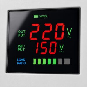Close-up of TND regulator LCD display showing input and output voltage
