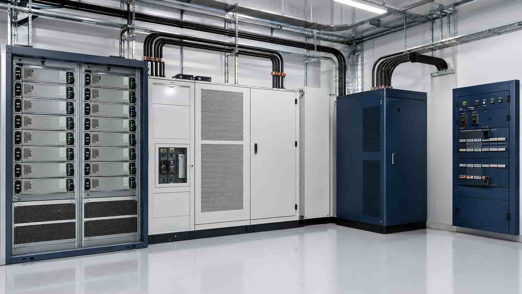 Industrial power conversion system showing rectifier modules, DC bus equipment and an inverter cabinet