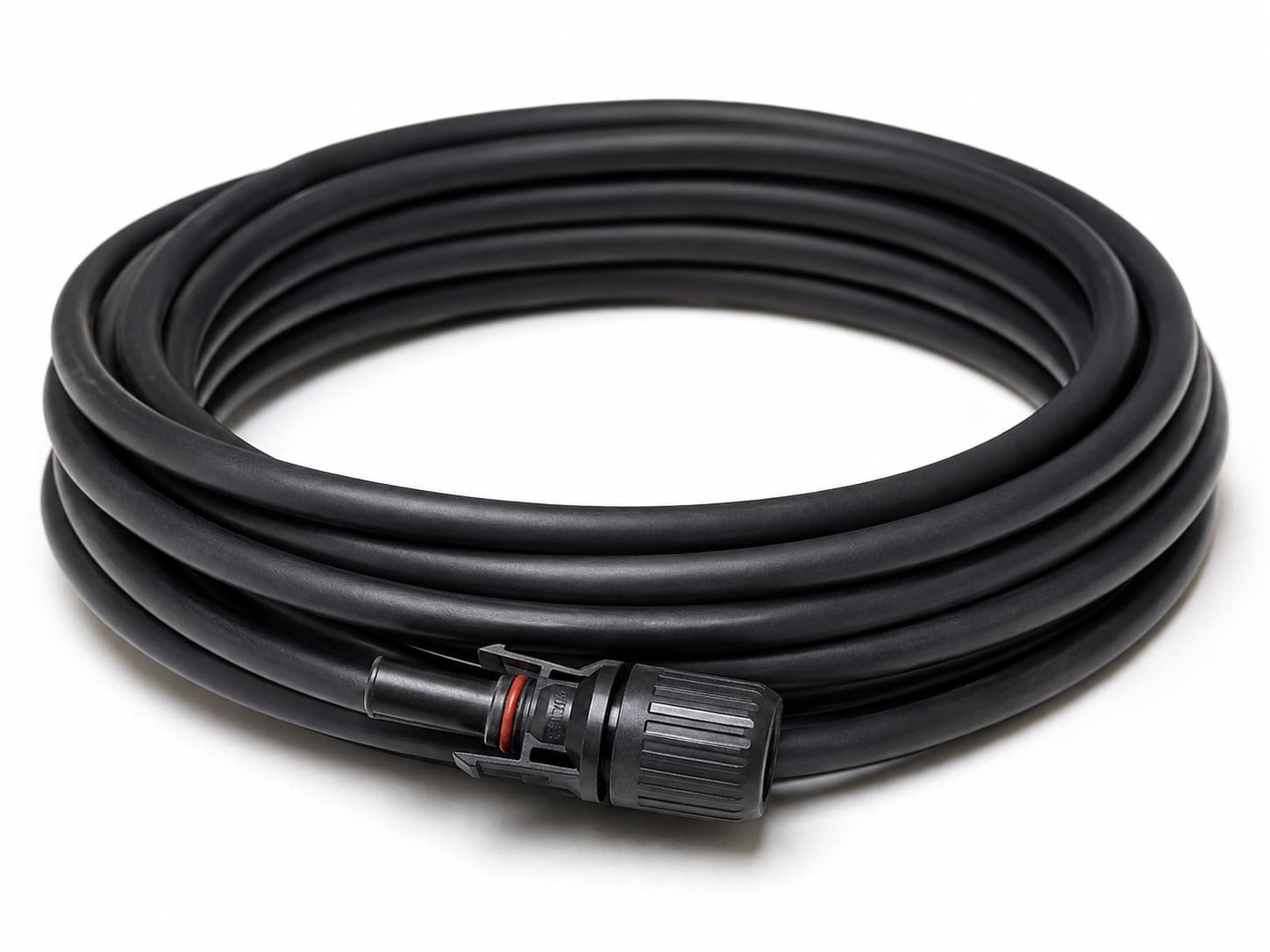 Coiled black solar PV cable with weather-resistant insulation and photovoltaic connector on white background