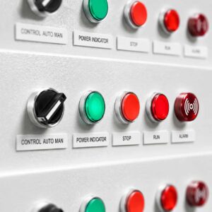 Close-up of a single control station with selector switch, pushbuttons and indicator lamps