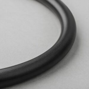 Close-up of flexible black chloroprene rubber jacket on elevator control cable